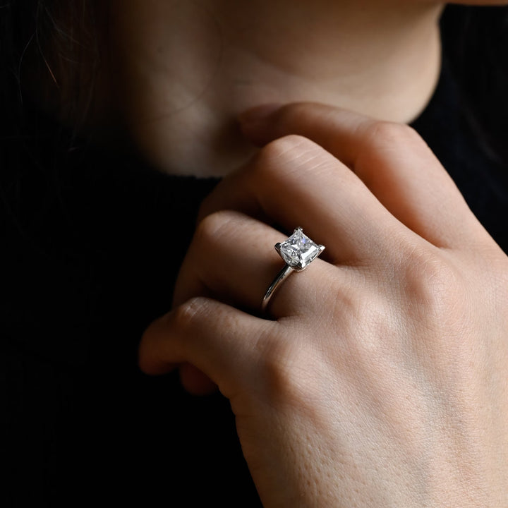 Angled view of princess cut diamond in solitaire setting