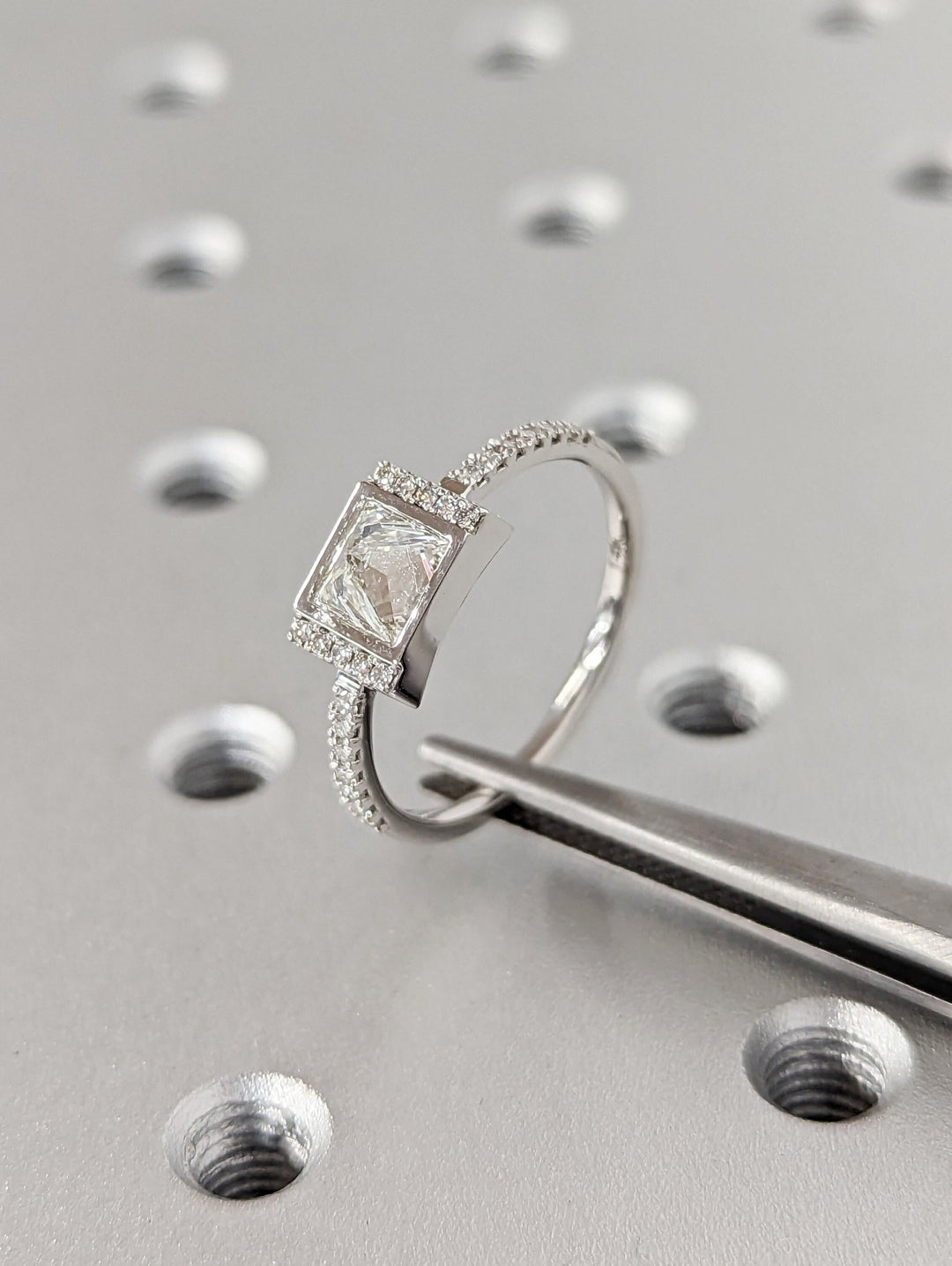 Certified princess cut diamond featured in pave engagement ring