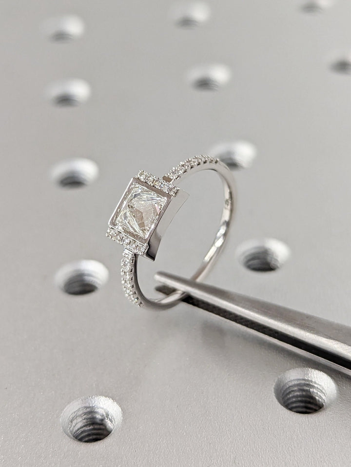 Certified princess cut diamond featured in pave engagement ring