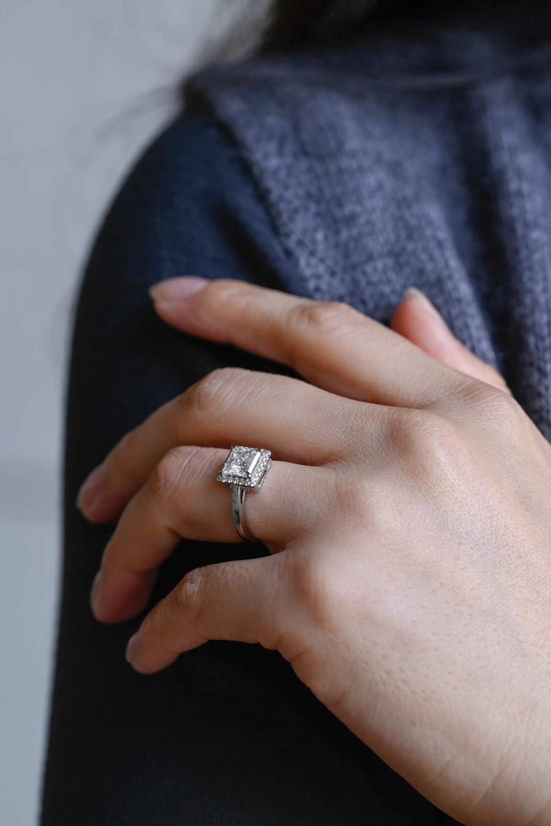 Princess halo engagement ring finished in polished solid gold