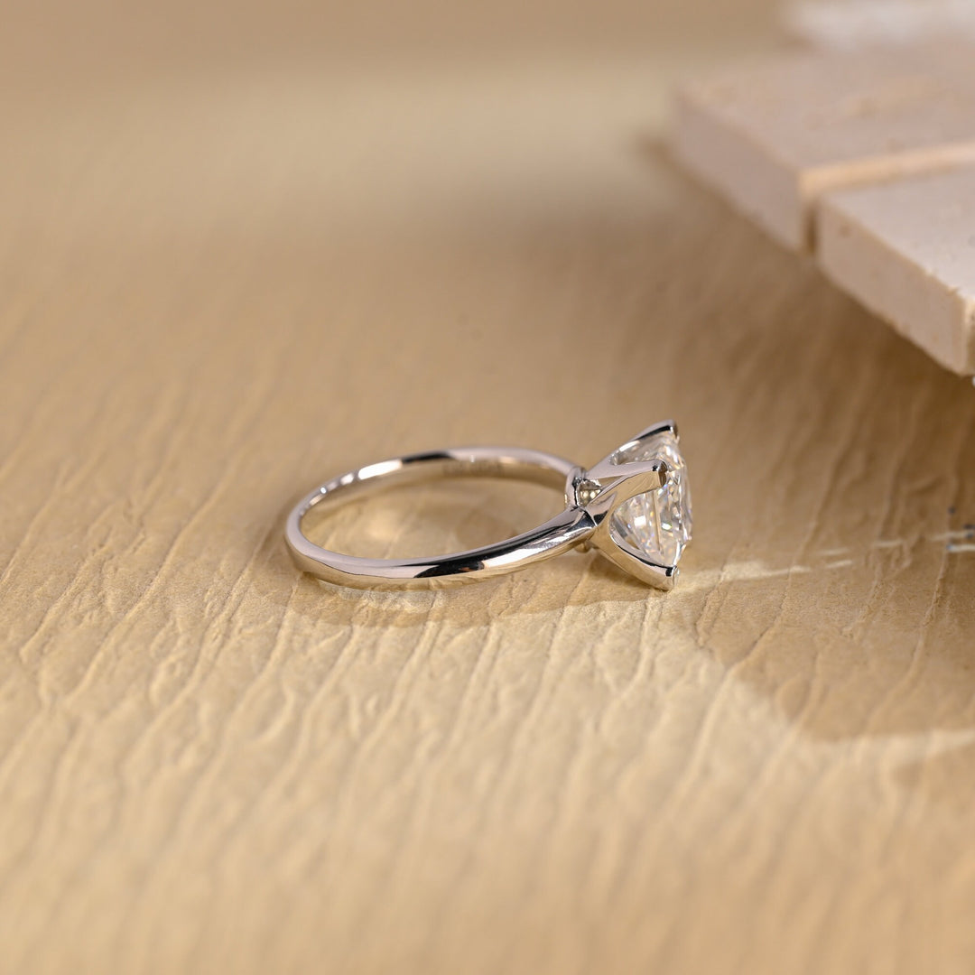 Princess solitaire engagement ring photographed in natural light