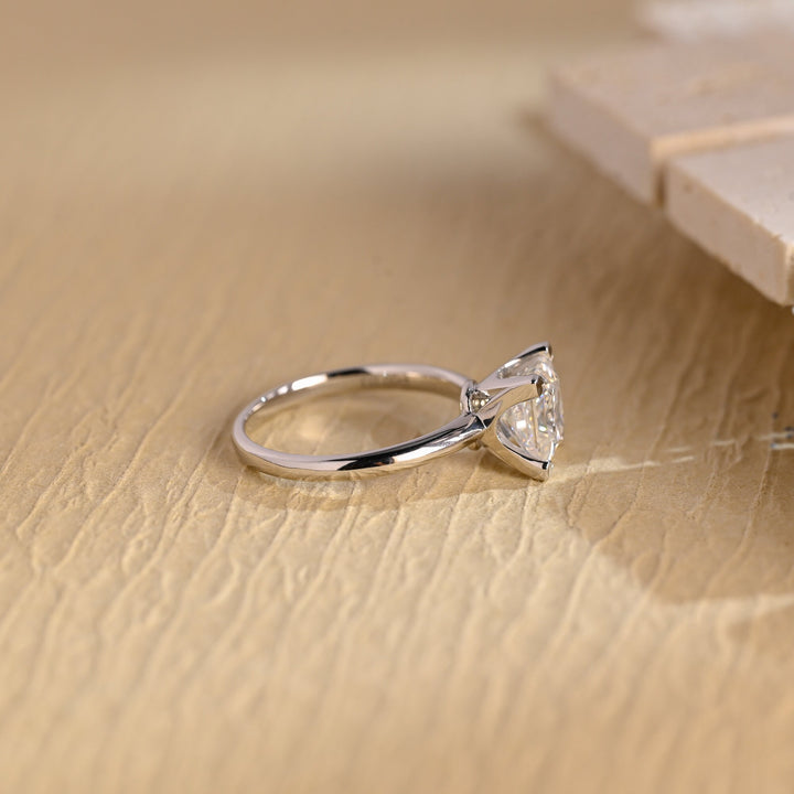 Princess solitaire engagement ring photographed in natural light