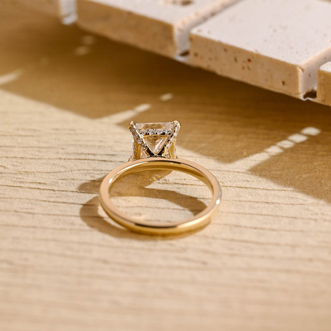 Princess hidden halo ring set with an IGI graded diamond