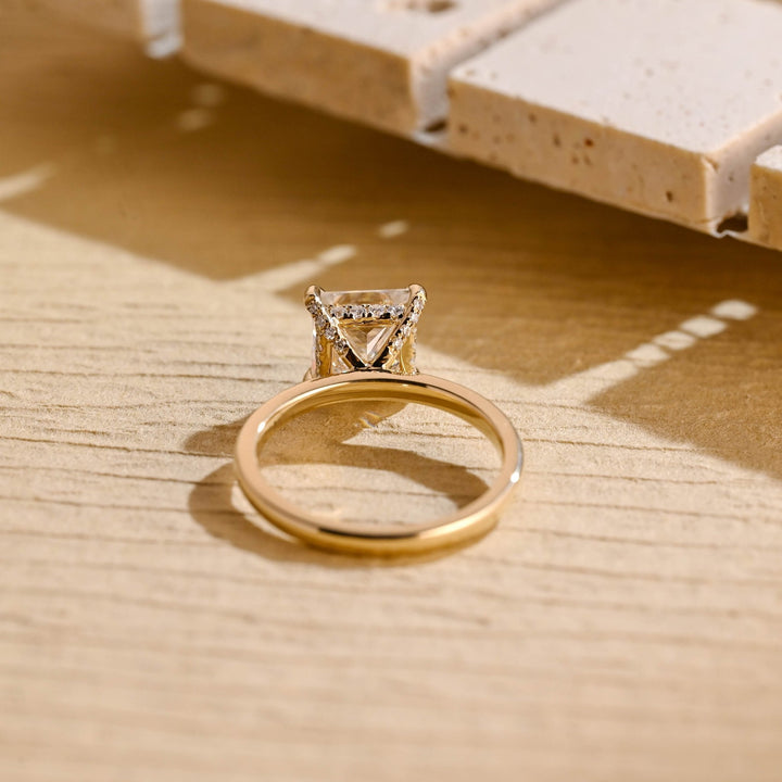 Princess hidden halo ring set with an IGI graded diamond