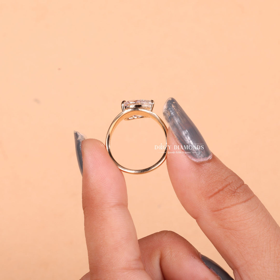 Pear cut diamond ring worn on hand
