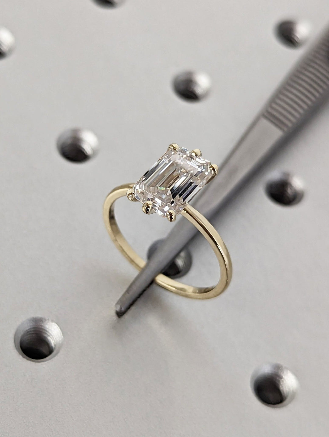 Emerald cut engagement ring side view showing band detail