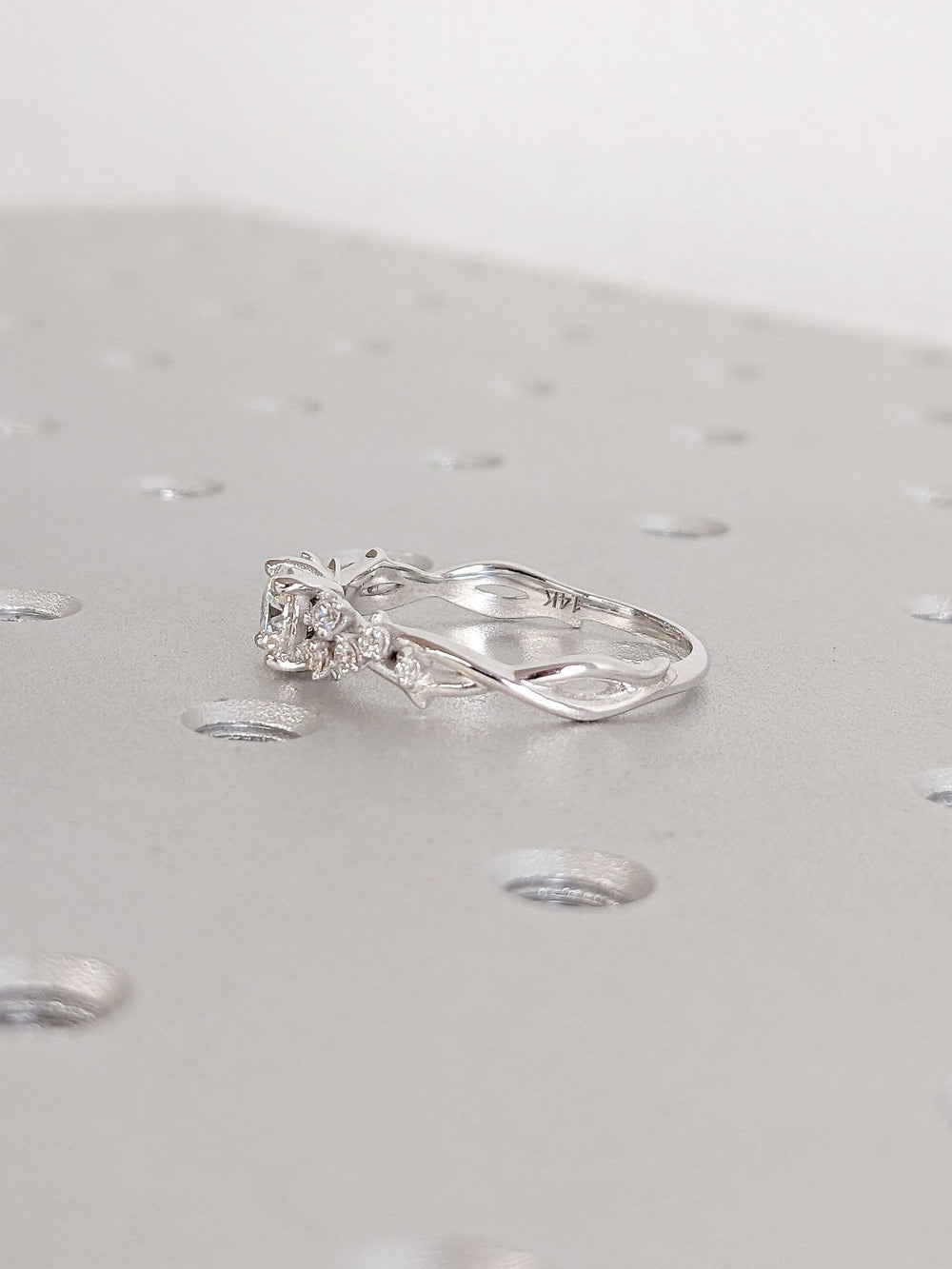 Round cluster engagement ring finished in polished solid gold