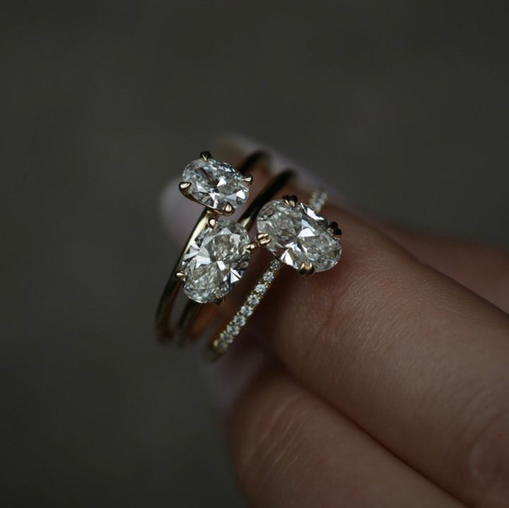 Oval cut solitaire engagement ring with IGI certified center diamond