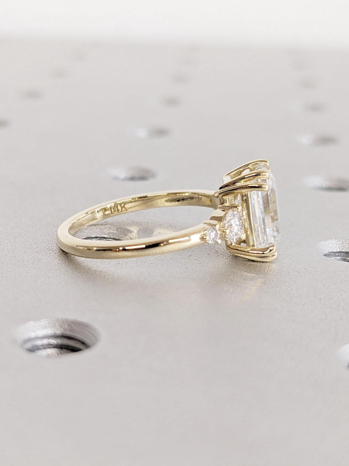 Premium emerald cut cluster engagement ring crafted in solid gold