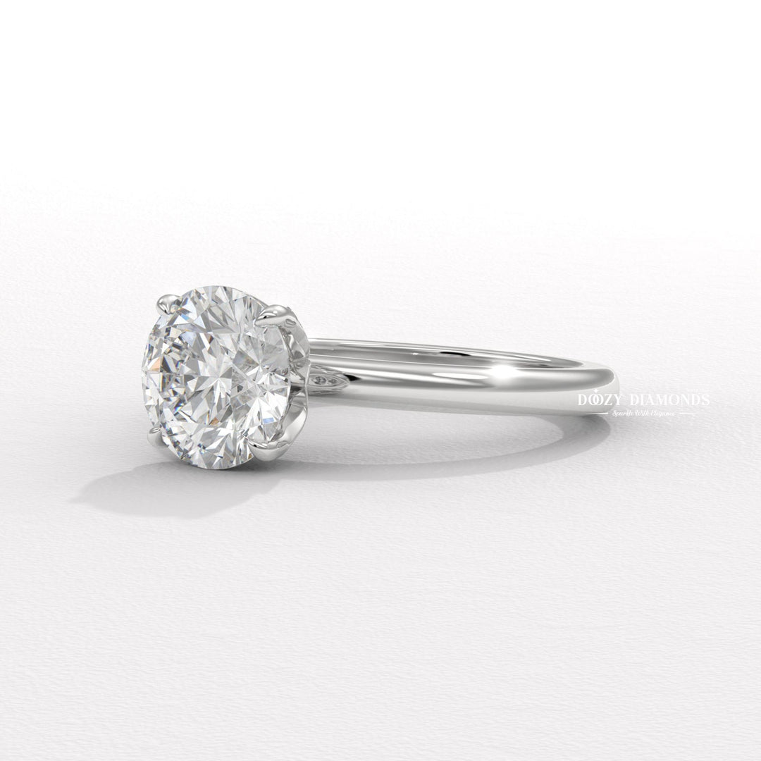 Round cut solitaire engagement ring shown in real-life wear