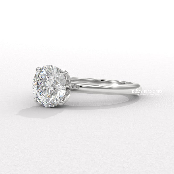 Round cut solitaire engagement ring shown in real-life wear