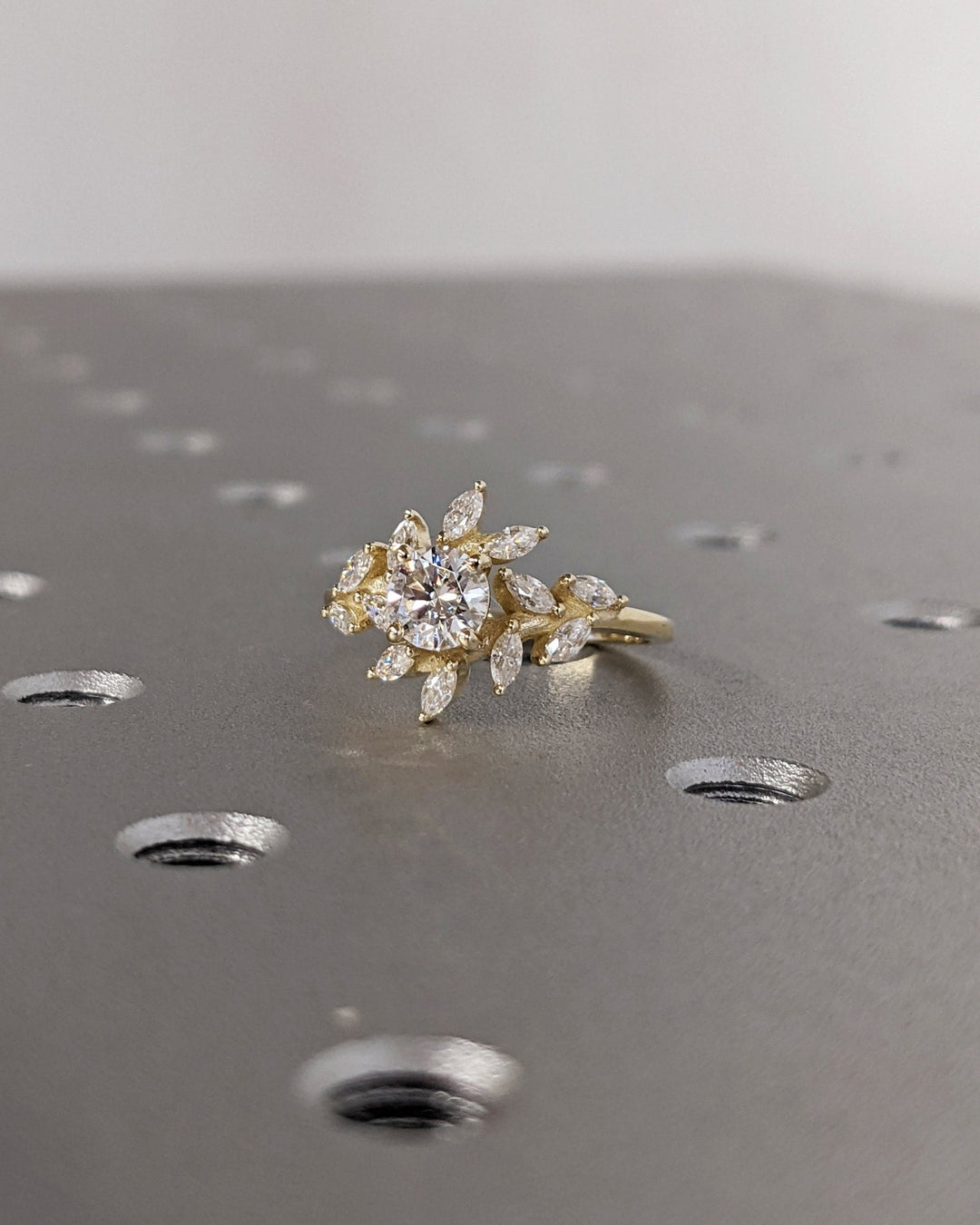 IGI certified round cut diamond in cluster engagement ring setting