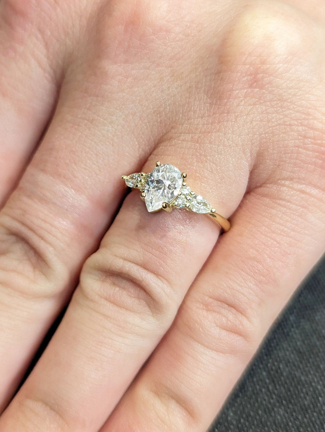 Pear cluster lab grown diamond ring fitted on finger