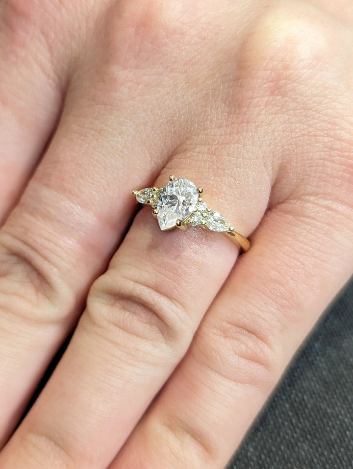 Pear cluster lab grown diamond ring fitted on finger
