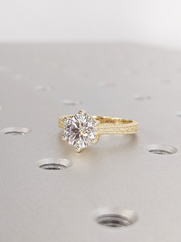 Macro shot of round cut diamond facets in vintage ring setting