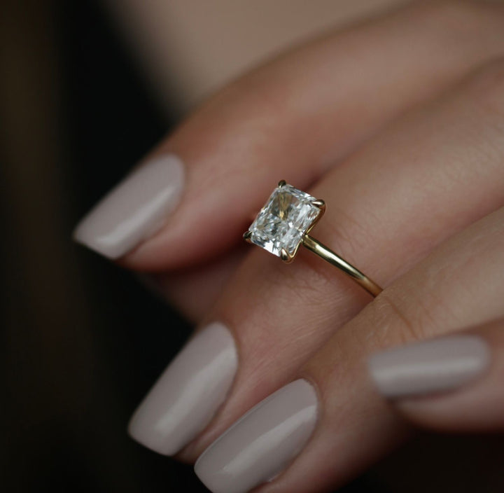 Radiant solitaire engagement ring close-up highlighting diamond sparkle