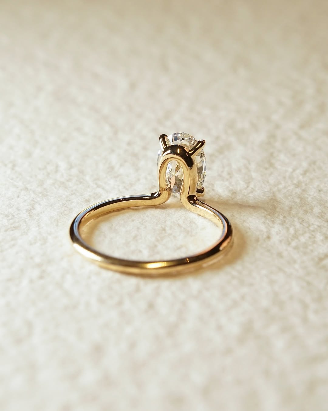 Profile view of oval cut solitaire engagement ring band