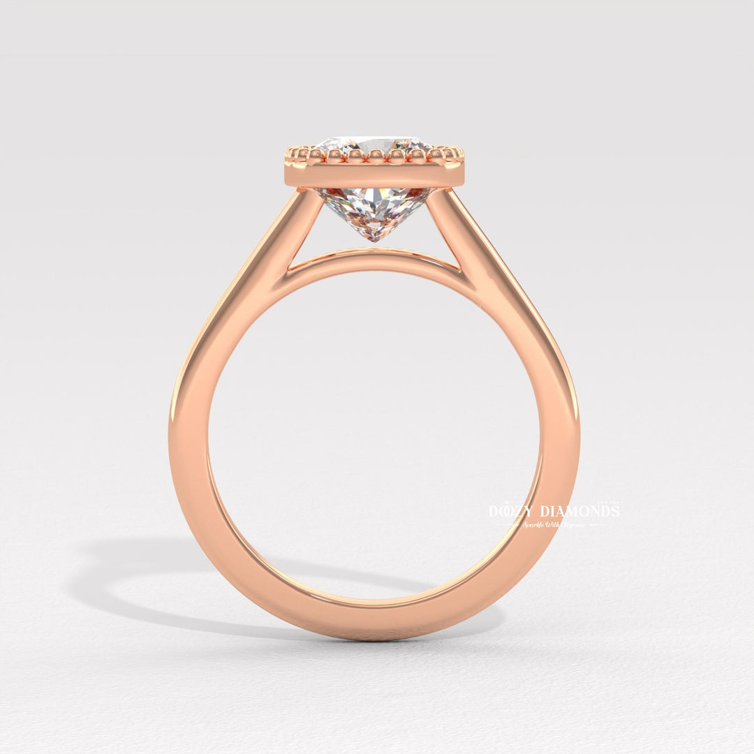 Cushion bezel engagement ring finished in polished solid gold