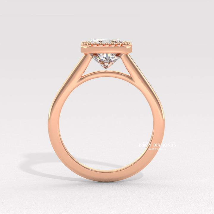 Cushion bezel engagement ring finished in polished solid gold
