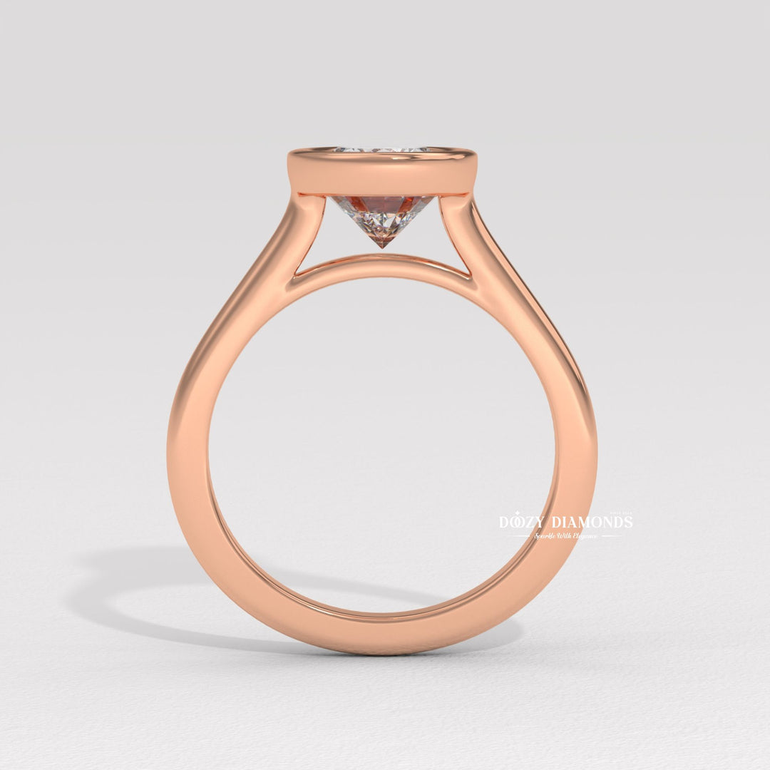 Oval bezel engagement ring shown on hand for true-to-life sizing