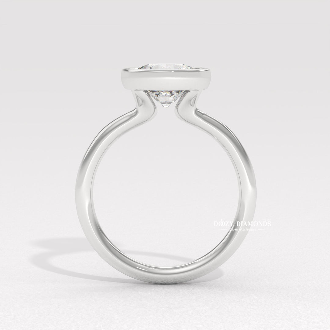 Round bezel diamond ring presented in signature gift packaging