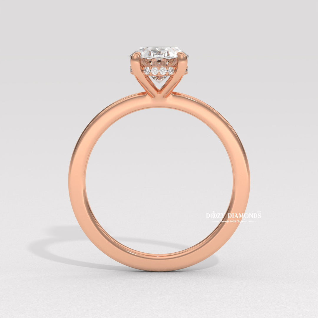 Oval solitaire lab grown diamond ring fitted on finger