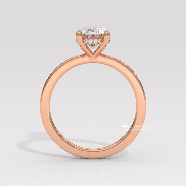 Oval solitaire lab grown diamond ring fitted on finger