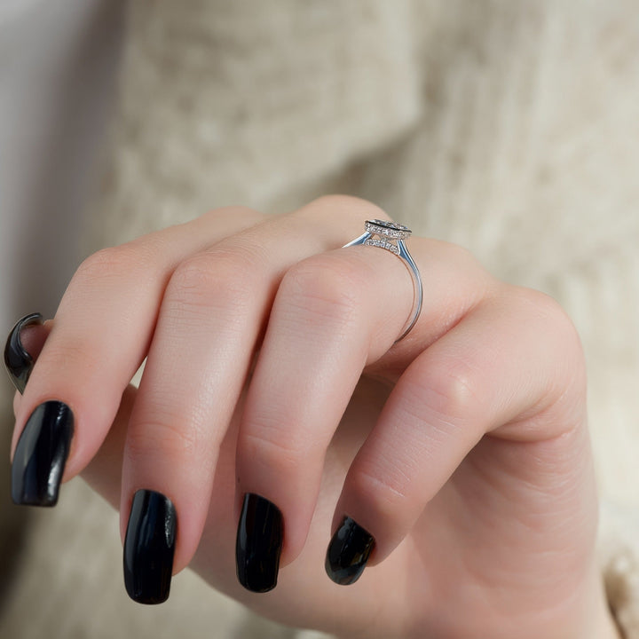 Cushion bezel diamond ring presented in signature gift packaging