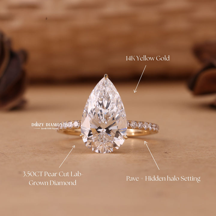 Pear cut hidden halo engagement ring with IGI certified center diamond
