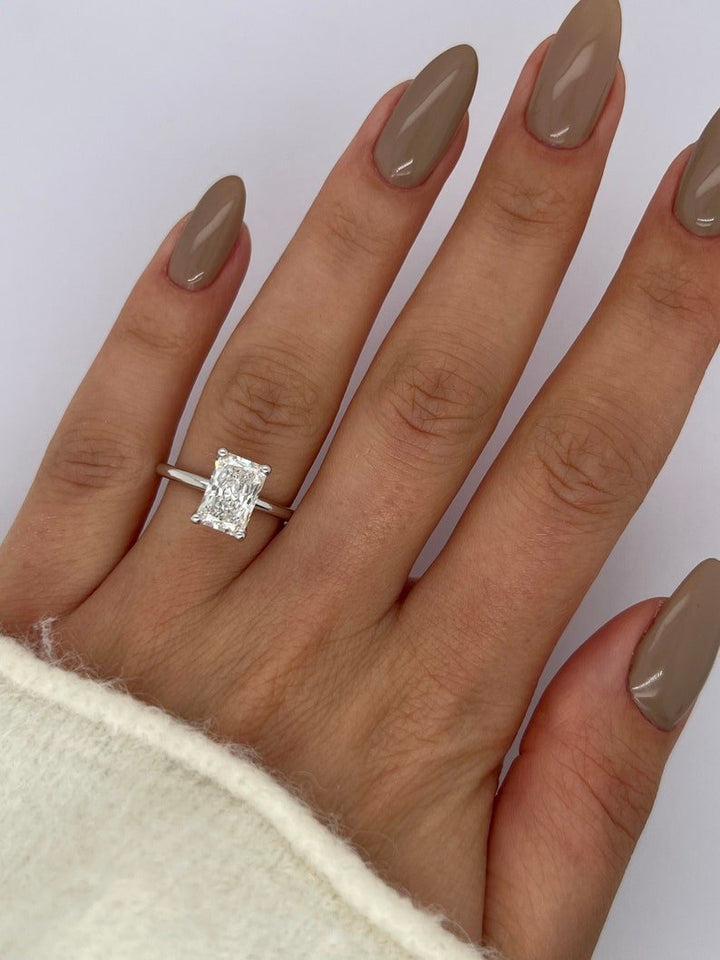 Detailed close-up of radiant solitaire diamond engagement ring