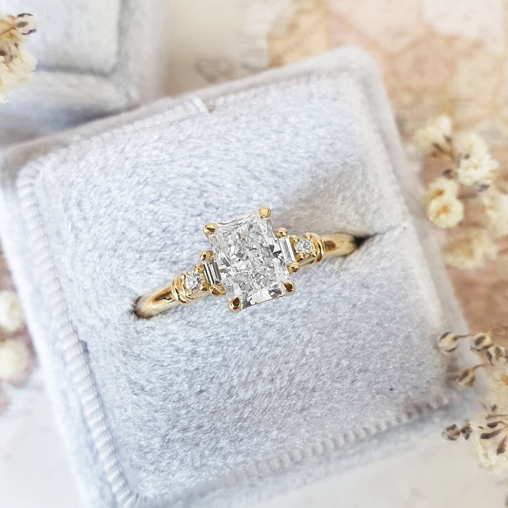 Lifestyle shot of radiant five stone diamond ring on hand