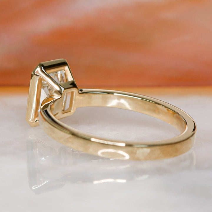 Radiant bezel engagement ring close-up highlighting diamond sparkle