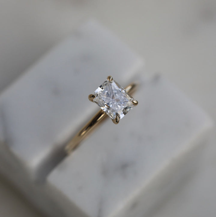 Radiant solitaire engagement ring with IGI certificate and packaging