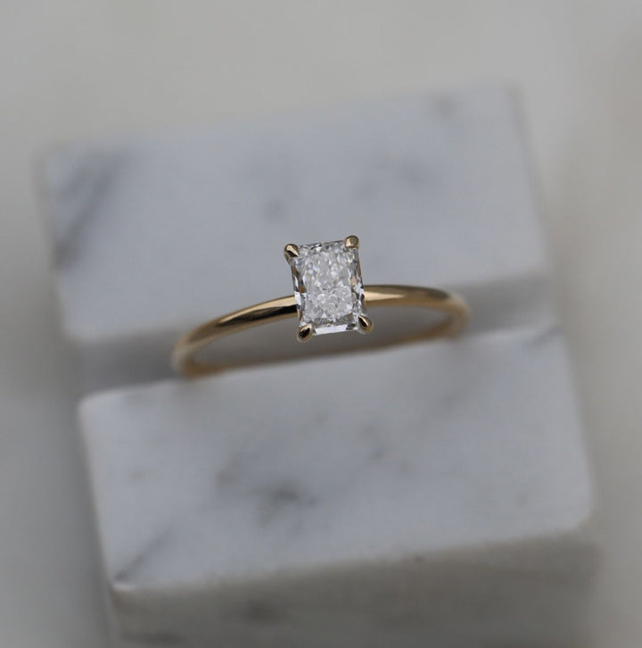 Macro shot of radiant cut diamond facets in solitaire ring setting