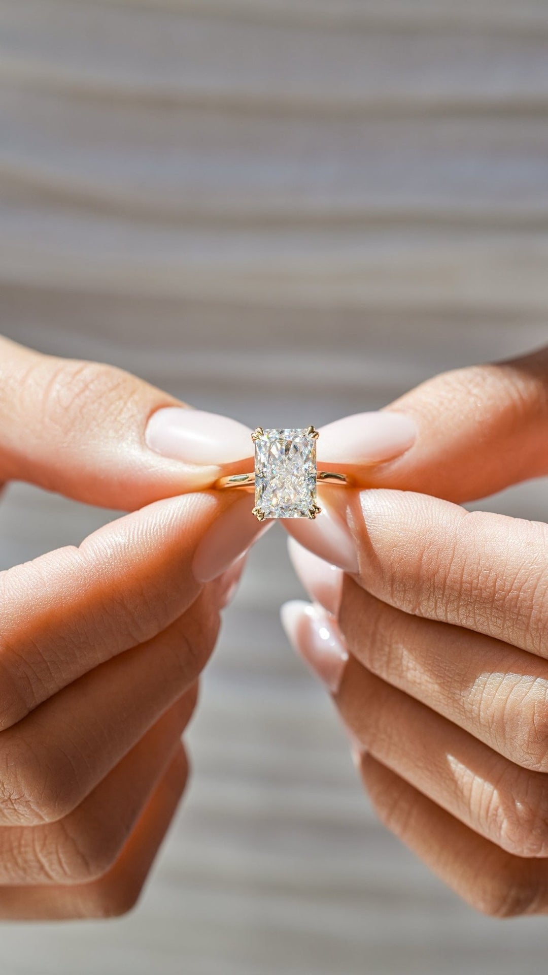 Radiant cut diamond ring worn on hand