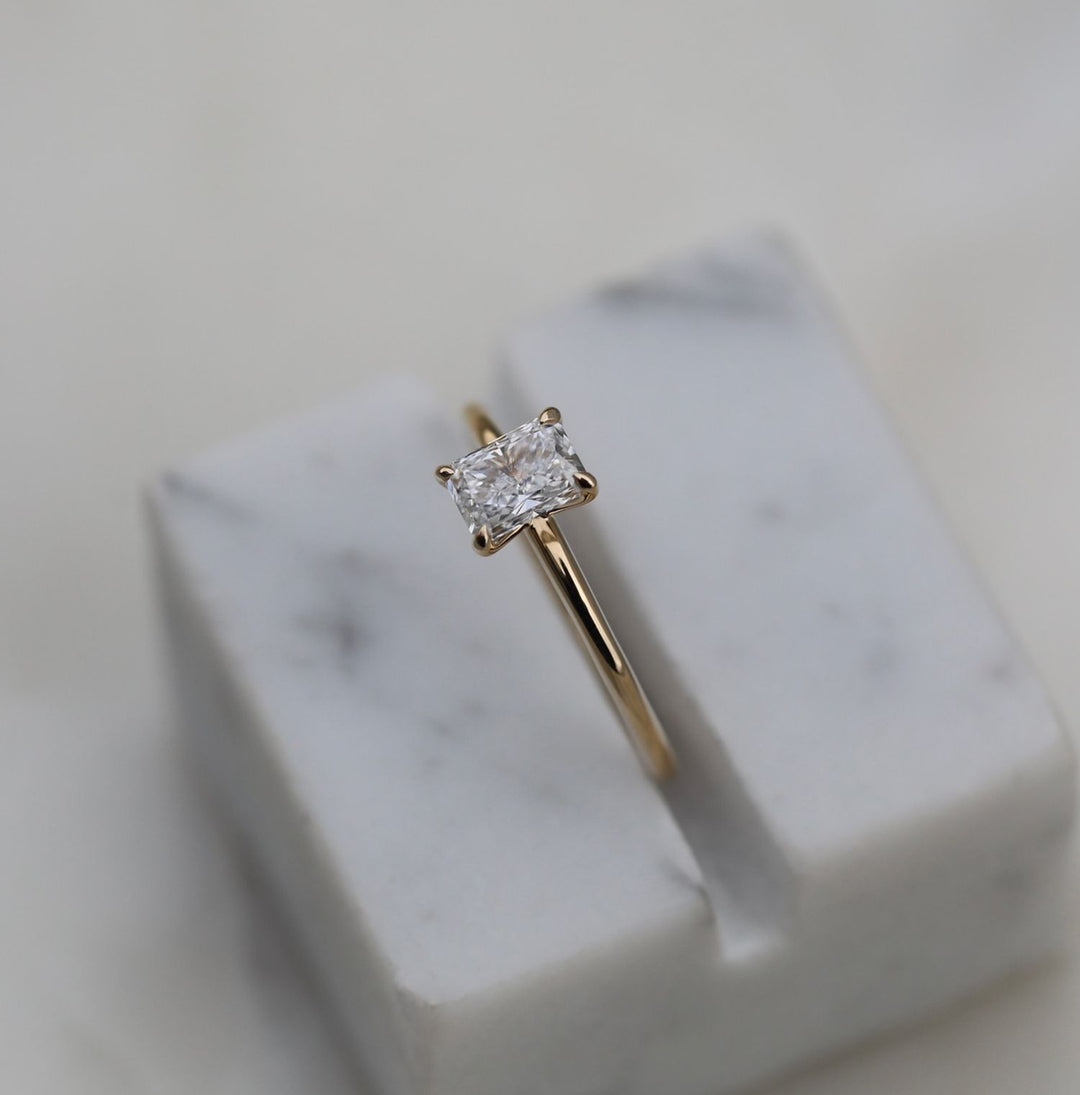 Radiant cut engagement ring side view showing band detail