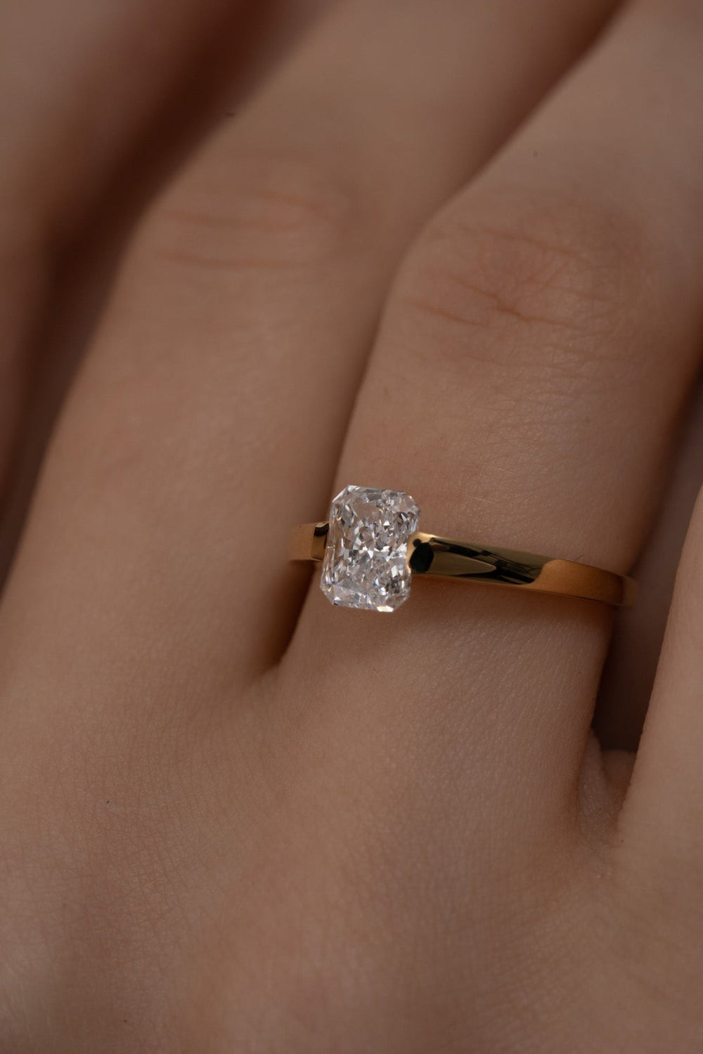 Radiant solitaire engagement ring with IGI certificate and packaging