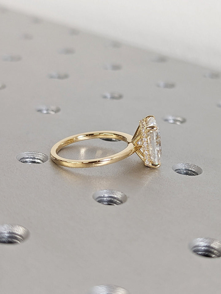 Unboxing view of radiant cut hidden halo diamond engagement ring