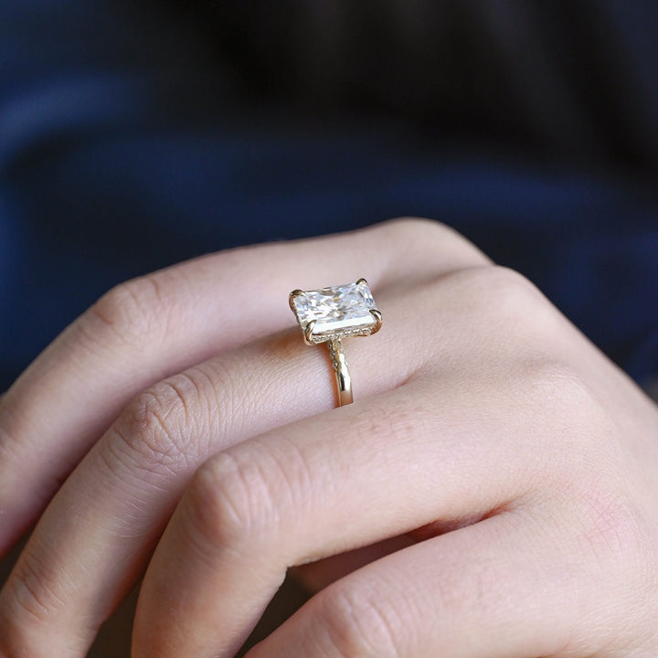 Angled view of radiant cut diamond in hidden halo setting