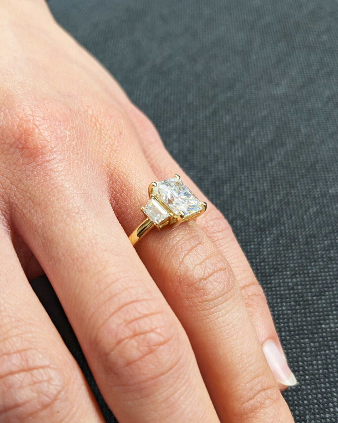 IGI certified radiant cut diamond in three stone engagement ring setting