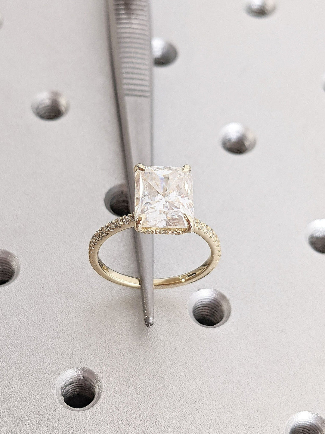 Radiant cut hidden halo engagement ring shown in real-life wear