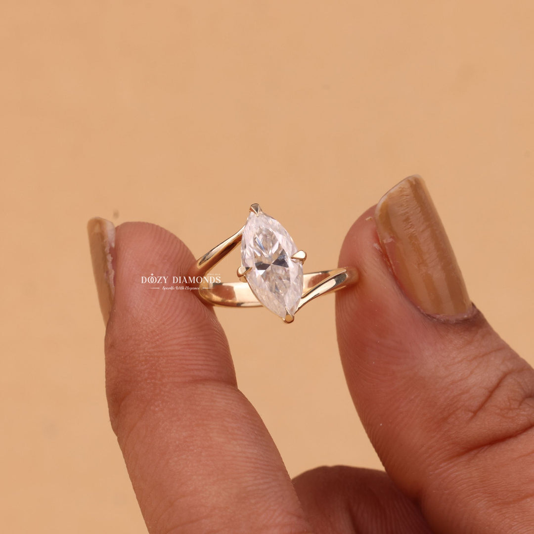 Close-up of marquise cut center diamond in solitaire engagement ring