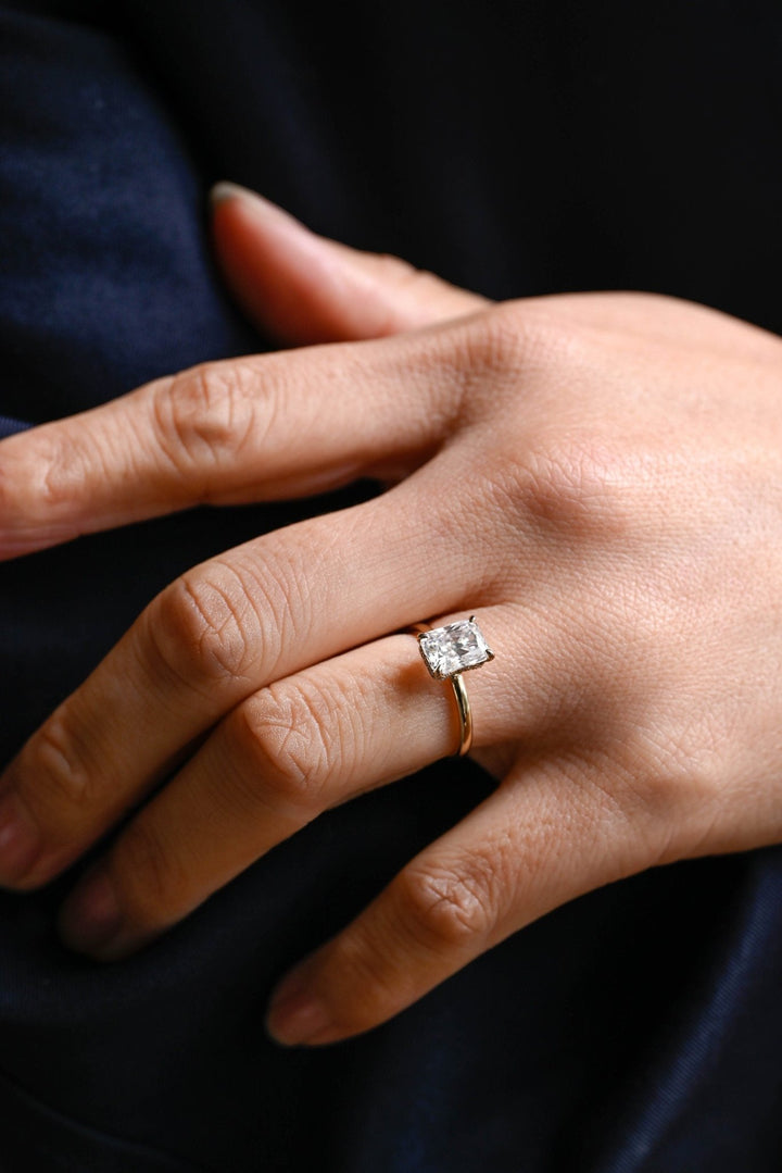 Macro shot of radiant cut diamond facets in hidden halo ring setting