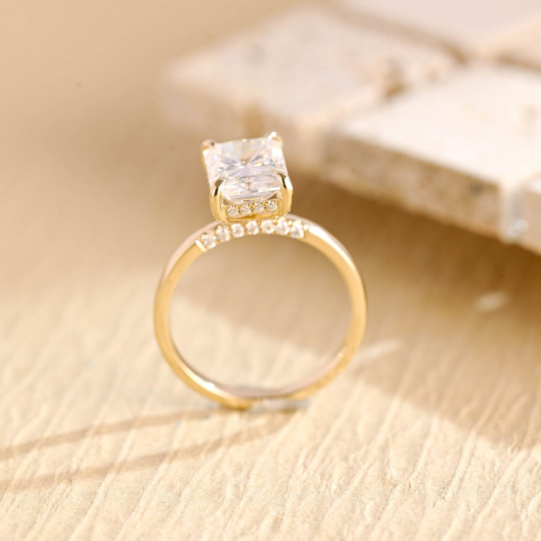Radiant hidden halo engagement ring finished in polished solid gold