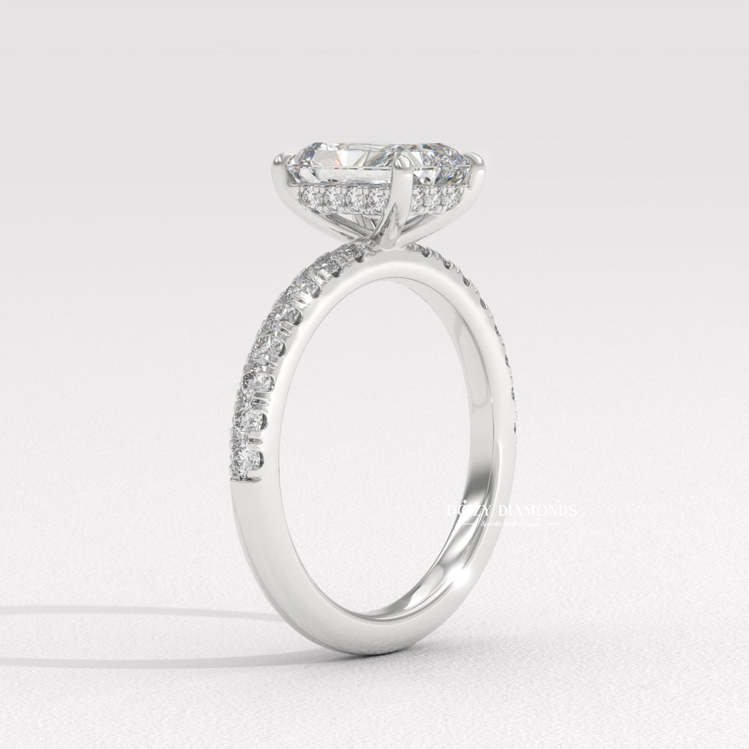 Radiant solitaire diamond ring displayed on jewelry stand