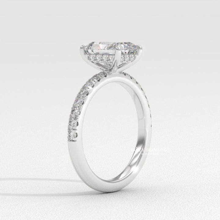 Radiant solitaire diamond ring displayed on jewelry stand
