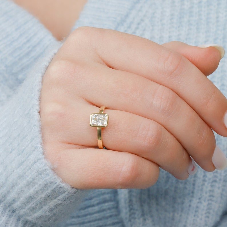 Detailed close-up of radiant bezel diamond engagement ring
