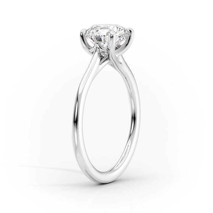 Radiant solitaire engagement ring photographed in natural light