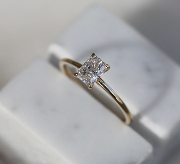 Detailed close-up of radiant solitaire diamond engagement ring