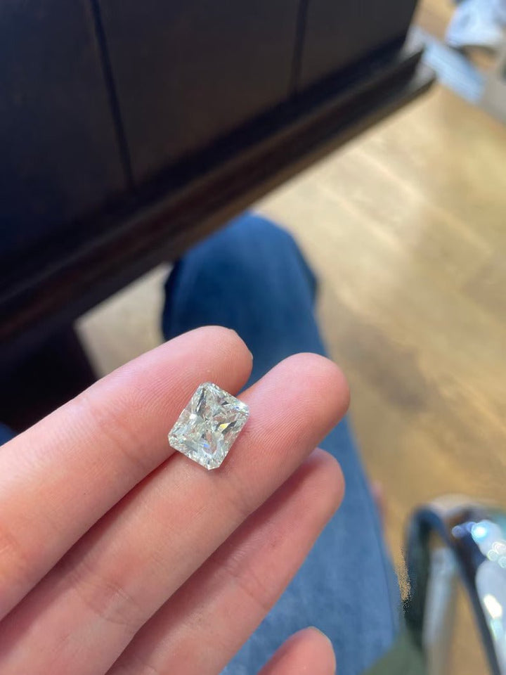 Radiant cut engagement ring side view showing band detail